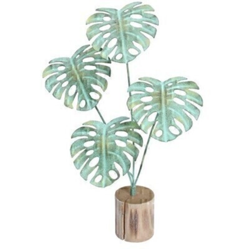 A realistic faux cheese plant ornament. This quirky metal ornament that mimics the 70's classic cheese plant sits on a rustic wooden base and is perfect for shelves or mantels. Made by London based designer Gisela Graham who designs really beautiful gifts for your home and garden.  Would suit any home decor and would make a lovely gift. 